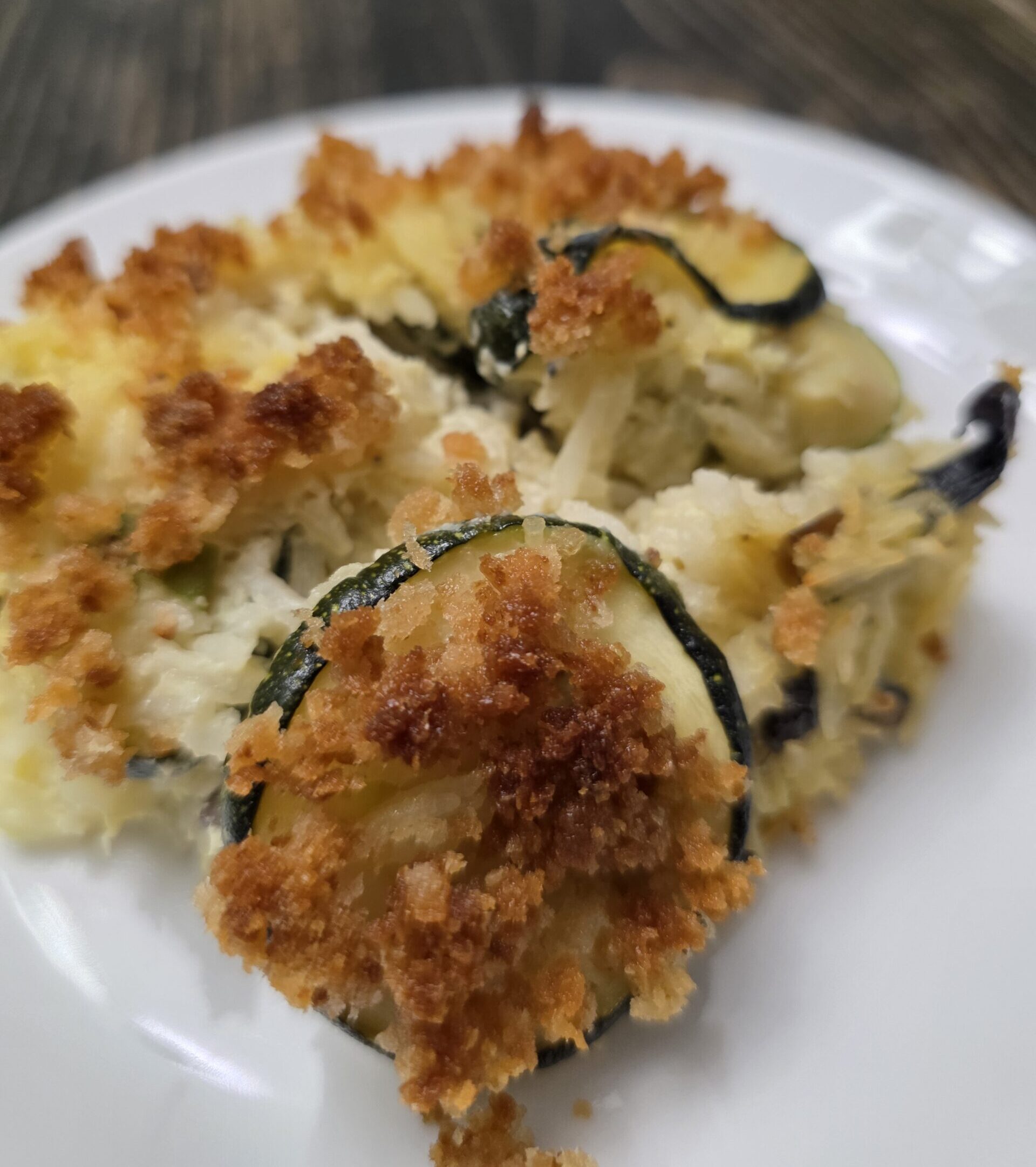 gluten free squash mushroom rice casserole on a white plate