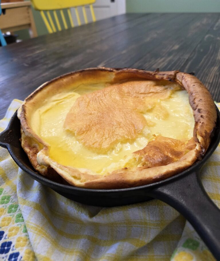 Gluten-Free Dutch Baby straight out of oven in a cast iron skillet