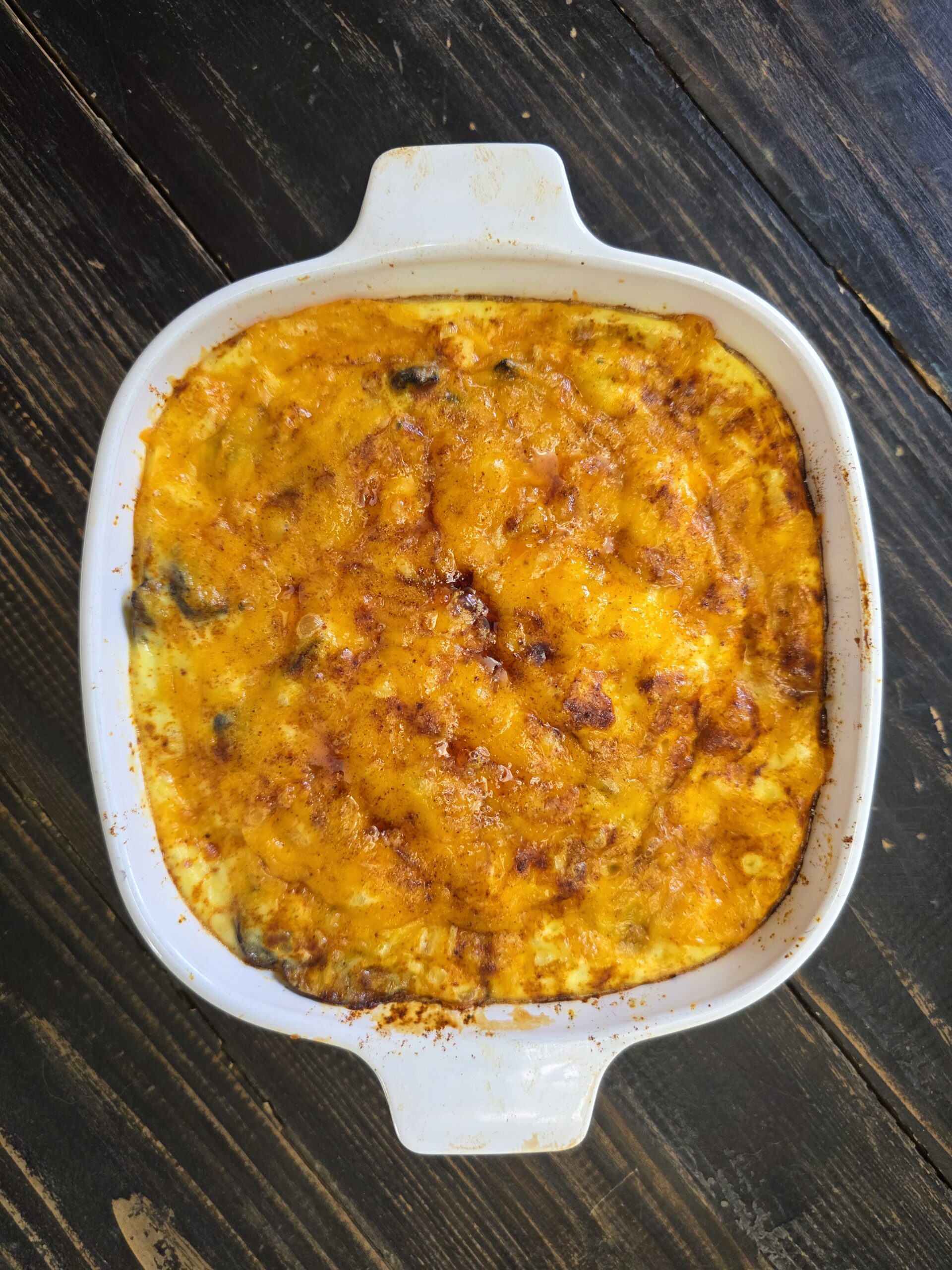 A sweet potato mushroom sharp cheddar breakfast dish pulled out of the oven