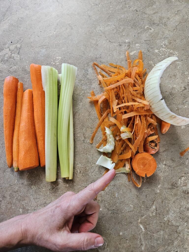 picture showing what veggie leftovers look like versus veggies for eating - the leftovers can be used to make chicken broth